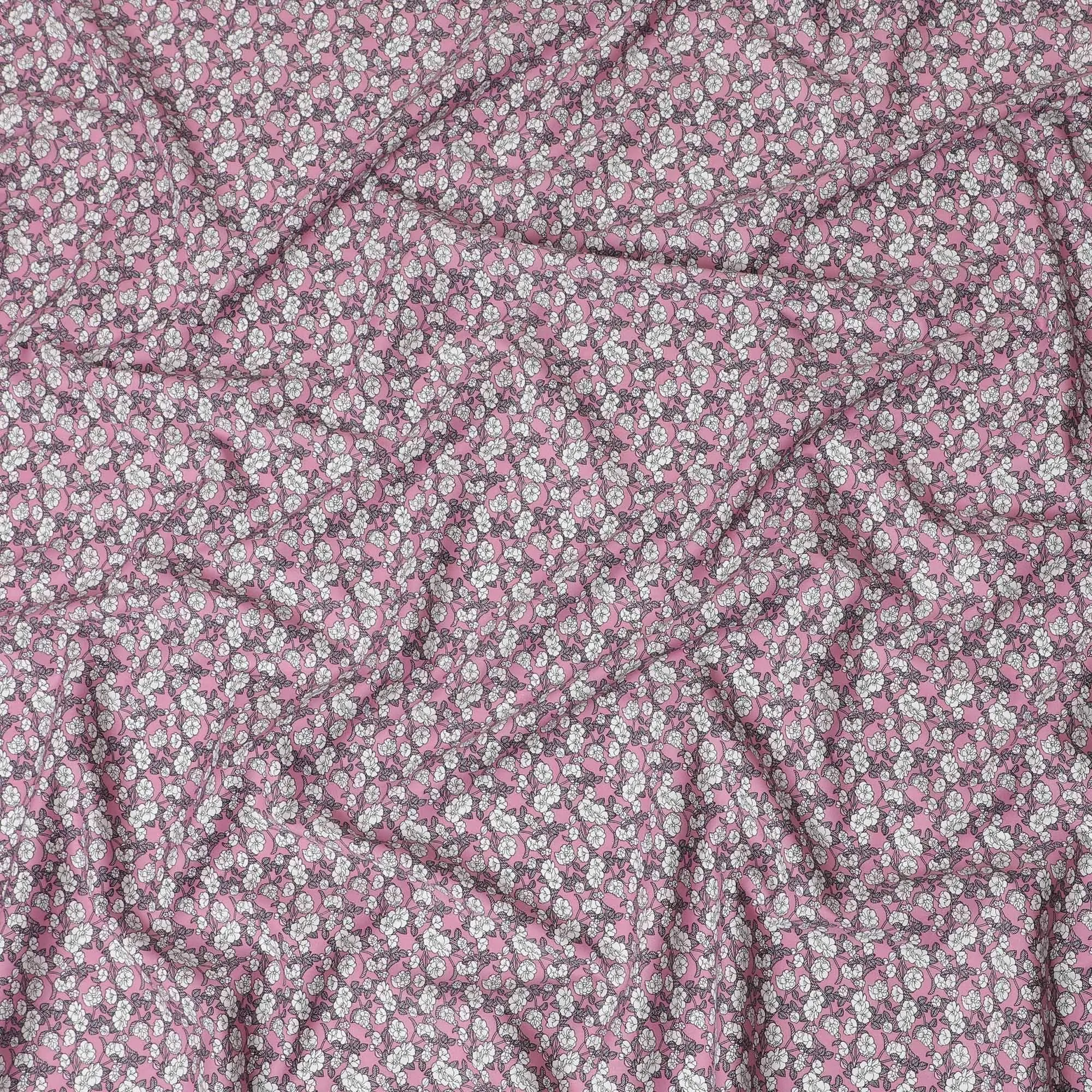 Baby pink cotton fabric with white and black print in floral design-D14843